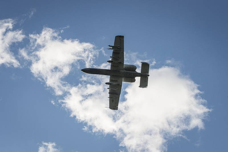 An A-10 Thunderbolt II flies over an airfield during a close-air support training mission at Eielson Air Force Base, Alaska, June 19, 2019.