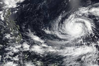 This Tuesday, May 23, 2023 satellite image released by NASA shows Typhoon Mawar, a powerful storm that could deliver the biggest hit in two decades to the U.S. territory in the Pacific, approaching Guam.