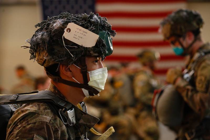 Sgt. Timothy Lee, a paratrooper with the 1st Brigade Combat Team, 82nd Airborne Division, prepares for an airborne operation at Fort Bragg, N.C., on May 7.