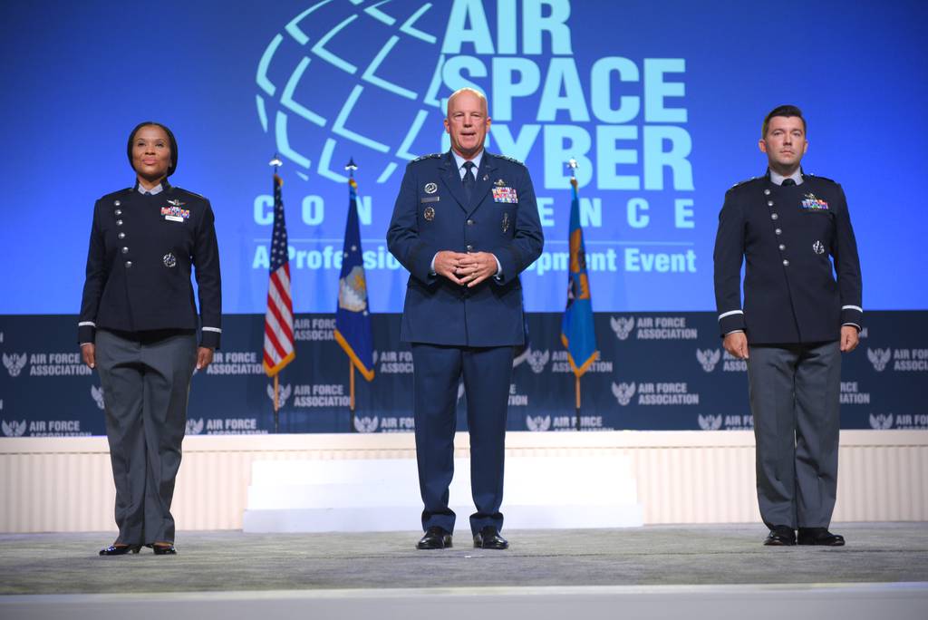 Chief of Space Operations Gen. John Raymond, center, introduces the new Space Force uniform prototypes at the Air Force Association's 2021 Air, Space & Cyber Conference on September 21. (Mike Tsukamoto/Air Force Magazine)