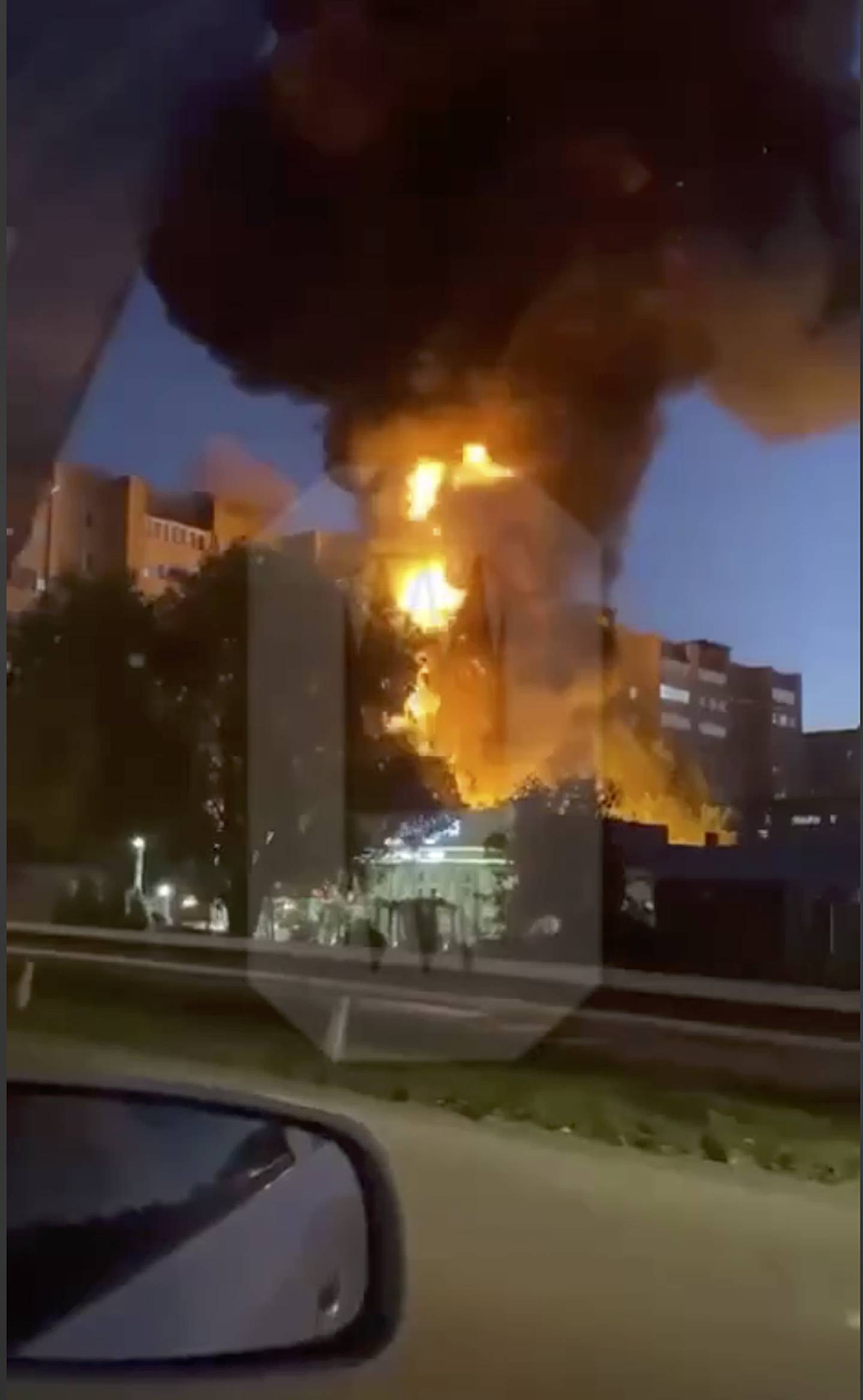 In this handout photo taken from video released by Ostorozhno Novosty, flames and smoke rise from the scene where a warplane crashed into a residential area in Yeysk, Russia, Monday, Oct. 17, 2022.