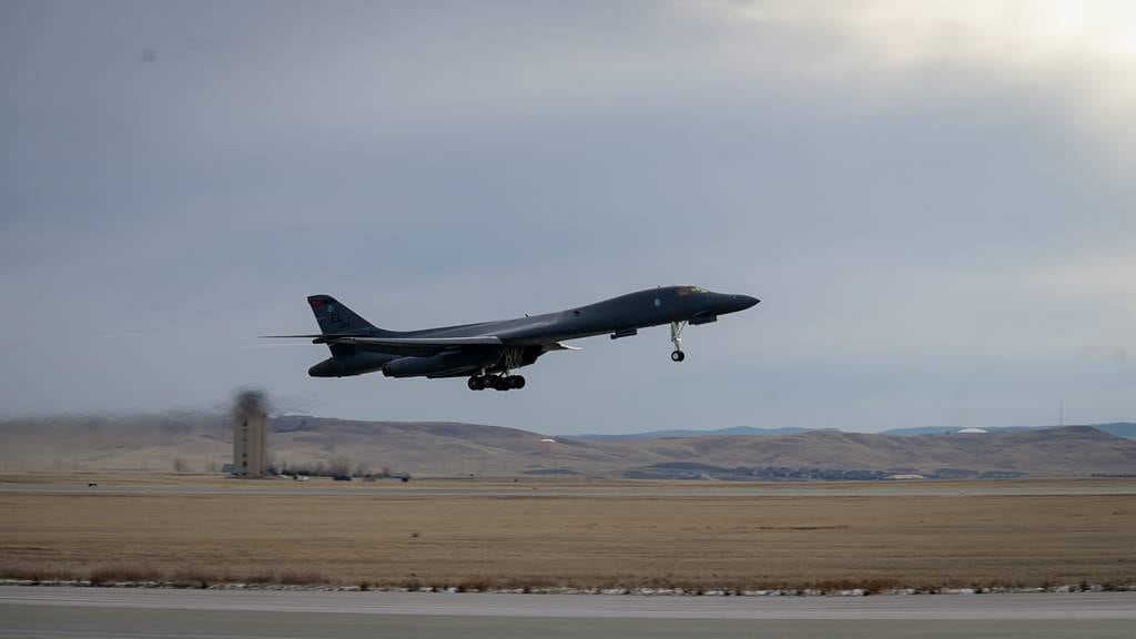 A B-1B Lancer takes off from Ellsworth Air Force Base, S.D., to participate in a tri-bomber flyover for the B-21 Raider unveiling ceremony in Palmdale, Calif., Dec. 2, 2022.