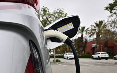 An electric vehicle is charged in Alhambra, California, on April 12, 2023.