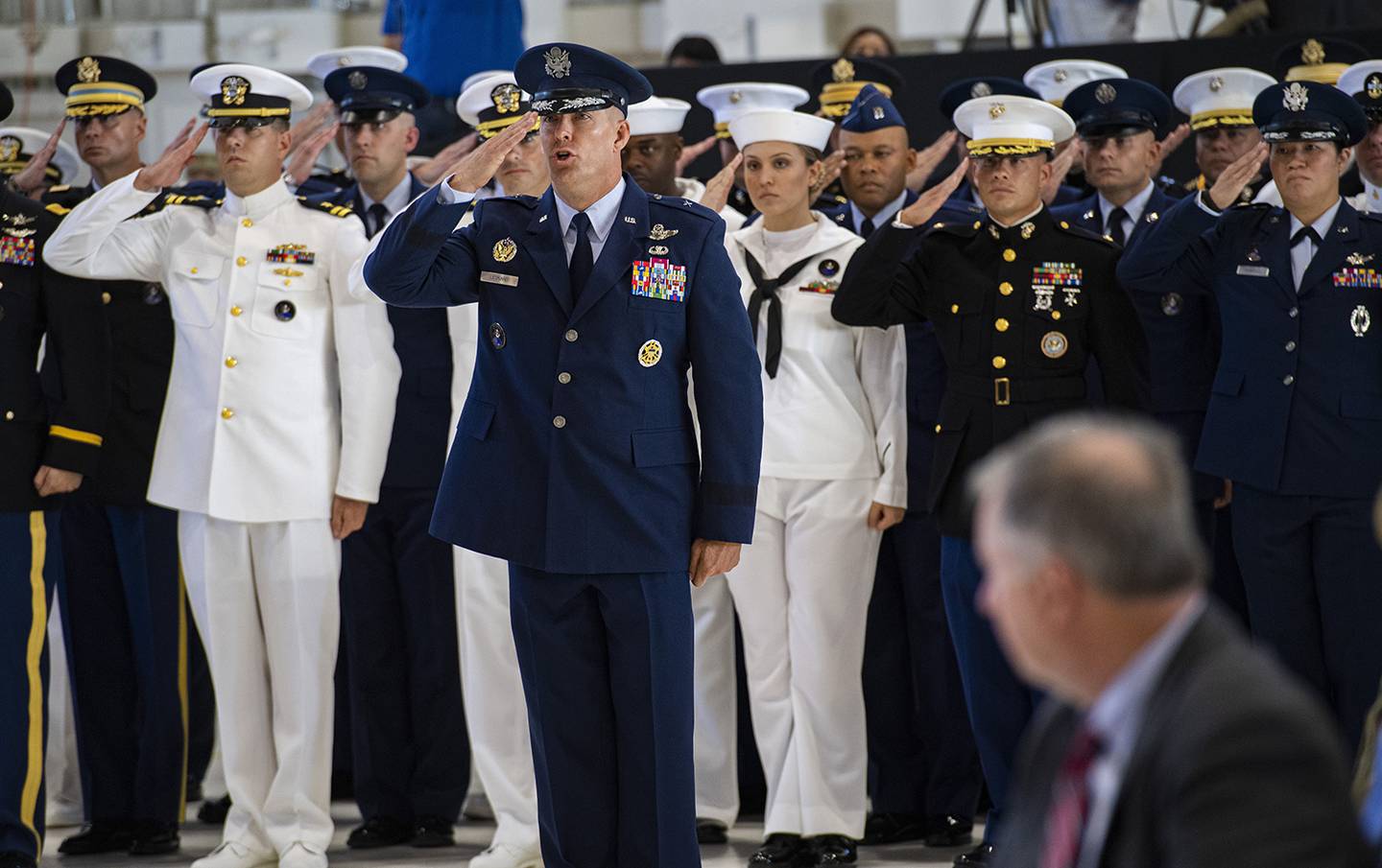 U.S. Space Command Chief of Staff, Brig. Gen. Brook Leonard, and the rest of his staff give their first salute to Commander Gen. John W. Raymond