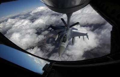 A U.S. Air Force F-16 refuels in mid-flight from a KC-135 Stratotanker during a Red Flag exercise over The Nevada Test and Training Range on Feb. 10, 2014.