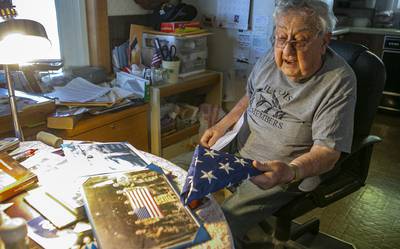 Robert Teichgraeber, 100, talks about the many gifts and honors he has received for his service in World War II on Nov. 6, 2020 in Collinsville, Ill.