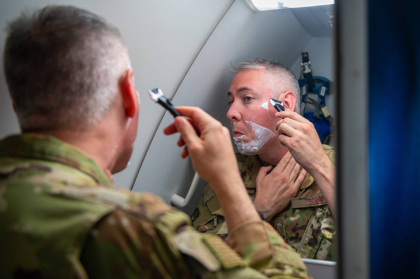 Maj. Kevin Rose, 349th Air Refueling Squadron instructor pilot, shaves his face May 6, 2022. Rose was one of six pilots aboard the 24-hour sortie out of McConnell Air Force Base, Kansas, which was the longest flight in Air Mobility Command’s history. (Airman Brenden Beezley/Air Force)