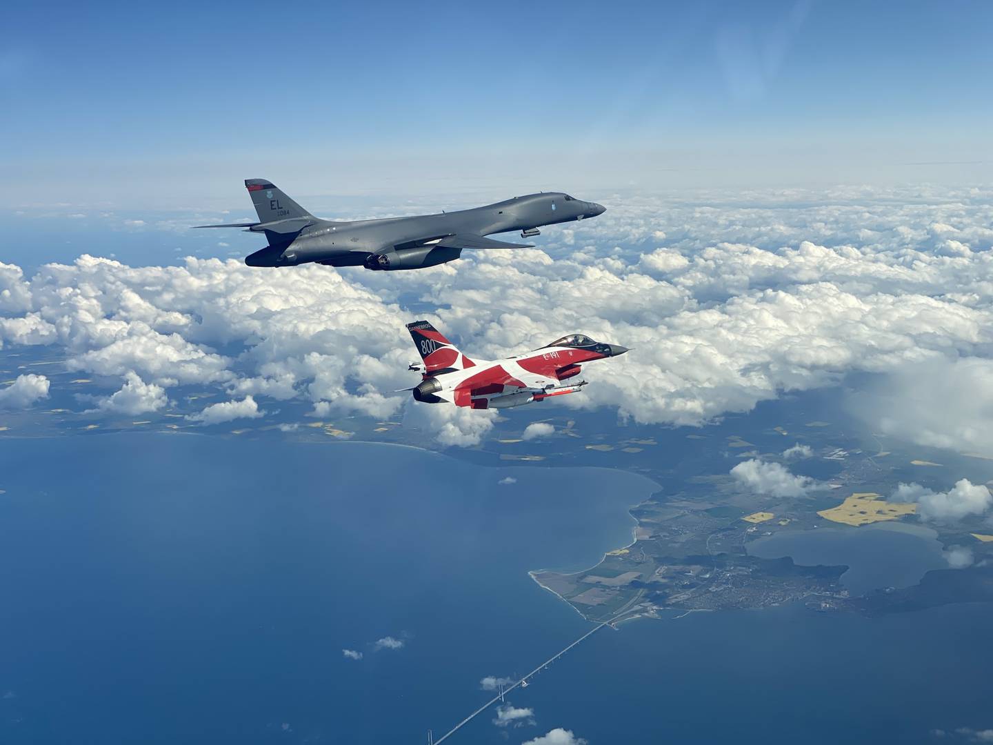 A B-1B Lancer flies with a Danish F-16 during a training mission for Bomber Task Force Europe, May 5, 2020.