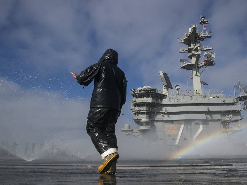 Aviation Boatswain's Mate (Handling) Airman Michael Meneses inspects the flight deck's countermeasure wash-down sprinklers on the aircraft carrier USS Abraham Lincoln (CVN 72) on May 16, 2020, in the Pacific Ocean.