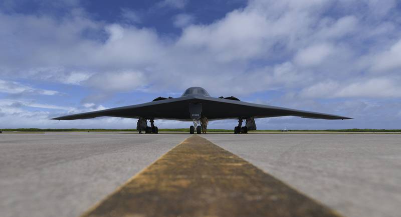 Senior Airman Robert Witkowski and Staff Sgt. Mark Farrar, 393rd Expeditionary Bomb Squadron crew chiefs, deployed from Whiteman Air Force Base, Mo., prepare a B-2 Spirit for takeoff at Naval Support Facility Diego Garcia in support of a Bomber Task Force mission, Aug. 17, 2020.