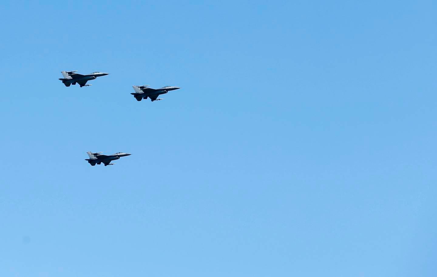In honor of Ross Perot's commitment to the military and veterans, F-16 fighter jets fly during his gravesite service in a missing man formation over Sparkman-Hillcrest Memorial Park Cemetery in Dallas on Tuesday, July 16, 2019.