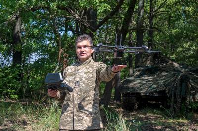 A Ukrainian soldier launches a drone near Kharkiv on July 23, 2022, amid the Russian invasion of Ukraine.