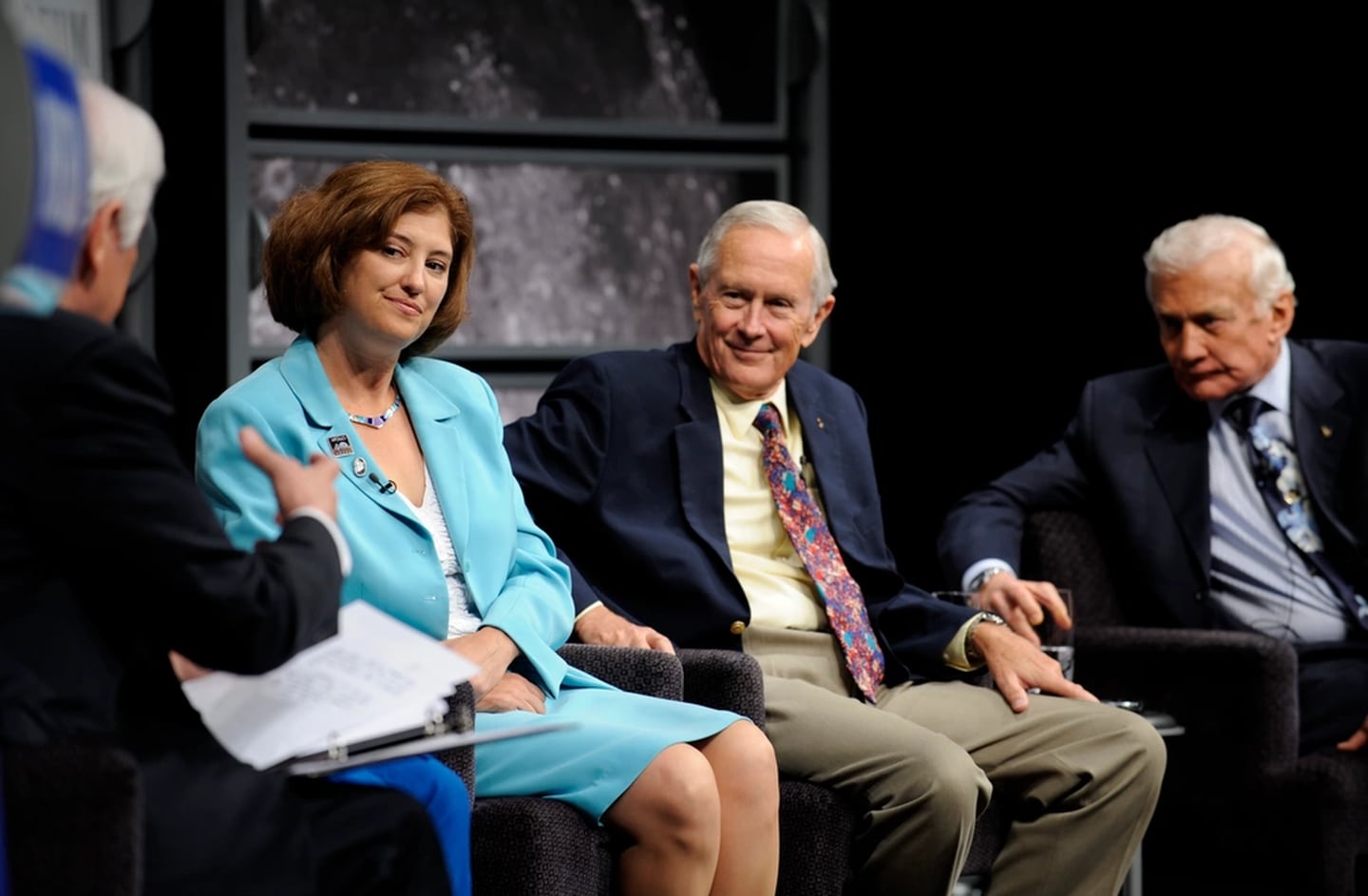 Veteran journalist Nick Clooney, seated left back to camera, moderated a panel discussion with Apollo 11 astronaut Buzz Aldrin, far right, Charlie Duke of Apollo 16, John Grunsfeld of the recent Hubble mission, not seen, and Goddard Space Flight Center deputy director Laurie Leshin, second from left, Monday, July 20, 2009, at the Newseum in Washington as part of the commemoration of the 40th Anniversary of the Apollo 11 moon landing. (Bill Ingalls/NASA)