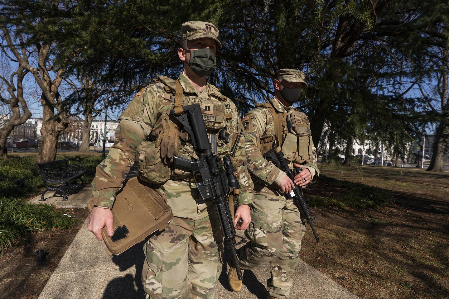 Armed members of the Maryland National Guard secures the perimeter around the U.S. Capitol, Wednesday, Jan. 13, 2021, in Washington.