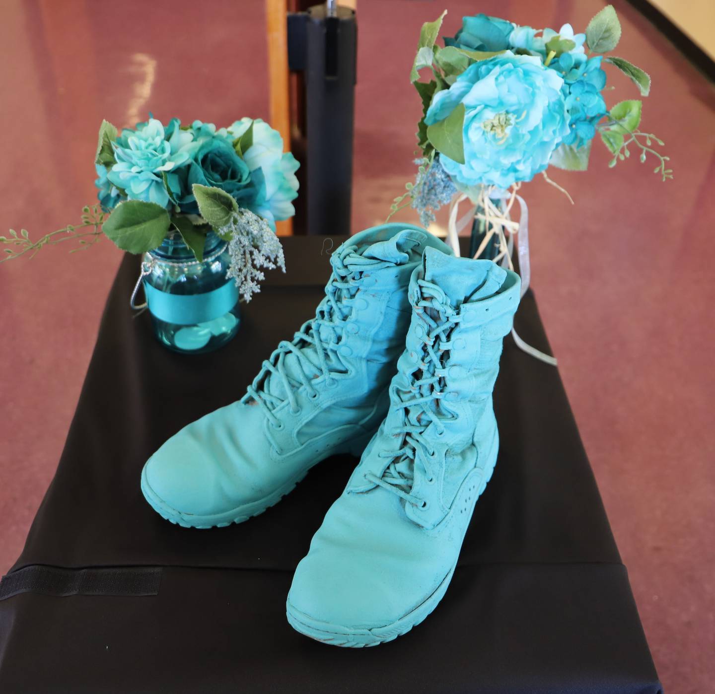 Teal shoes on display at McMahon Auditorium April 22, 2021, for the Sexual Assault Awareness Prevention Month book club. The shoes were painted teal and displayed to bring awareness to SAAPM.
