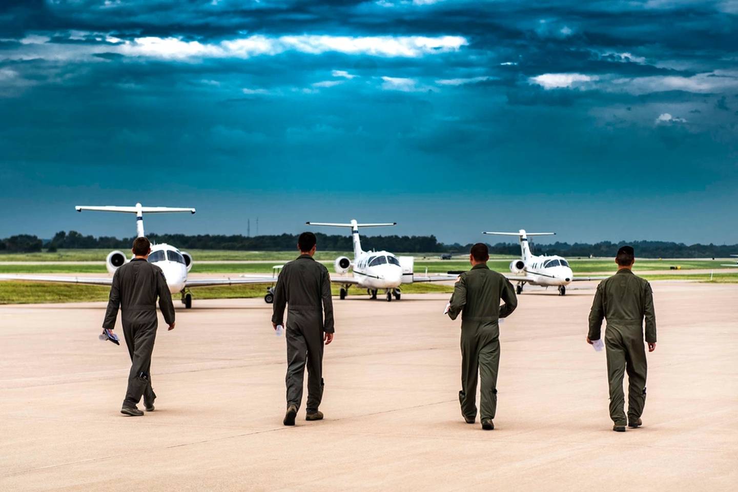 Members of the 3rd Flying Training Squadron walk to their T-1 Jayhawk aircraft at Northwest Arkansas Regional Airport, Aug. 26, 2018. Continuation training allows instructor pilots to maintain their proficiency and qualifications. (Tech. Sgt. Erik Cardenas/Air Force)