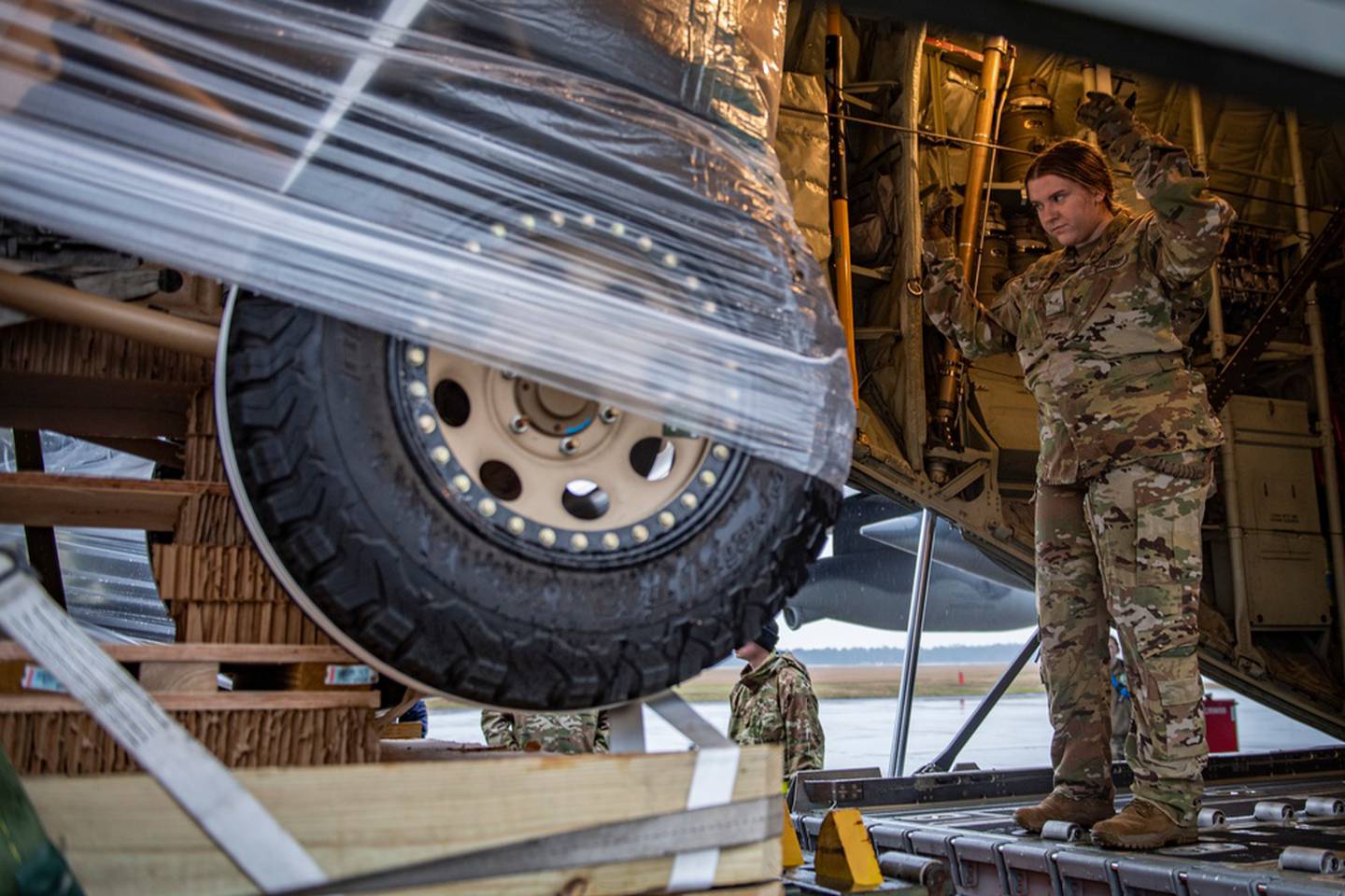 U.S. Air Force Airman 1st Class Taryn Kraemer, 71st Rescue Squadron loadmaster, guides a Side by Vehicle into the back of an HC-130J Combat King II at Moody Air Force Base, Georgia, Jan. 20, 2022. Understanding capabilities and limitations of the loading and support equipment is vital prior to employing it in austere locations. (Master Sgt. Daryl Knee/Air Force)