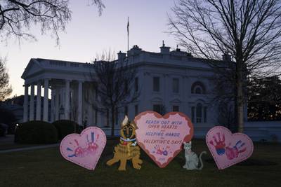 Valentine's Day decorations adorn the White House lawn, Tuesday, Feb. 14, 2023, in Washington.