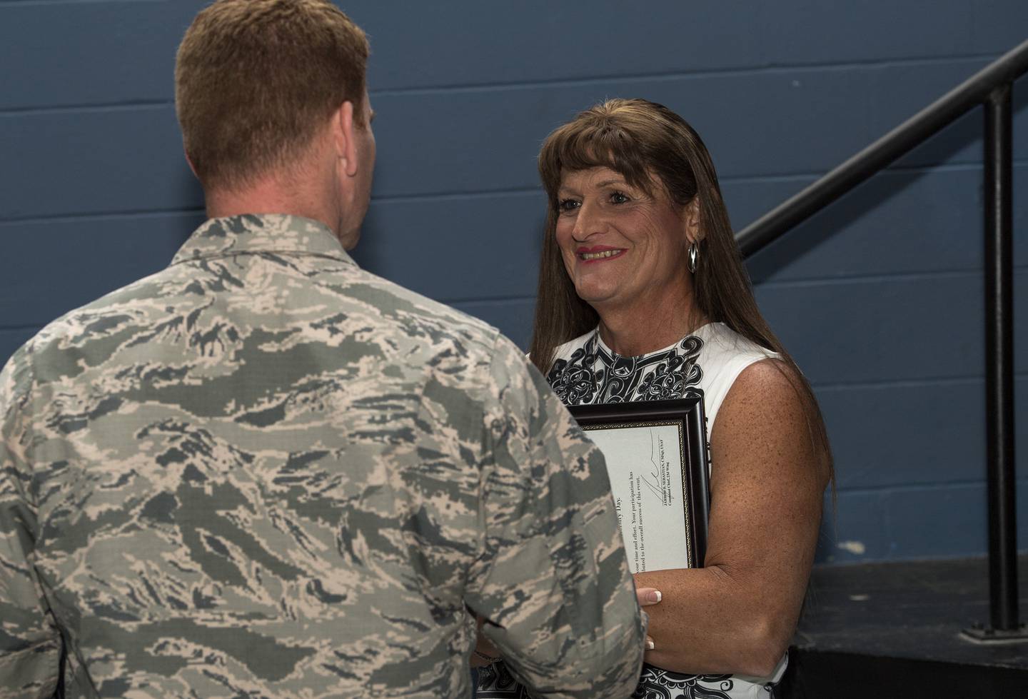 Retired U.S. Air Force Maj. Laura Perry, 45th Medical Operations Squadron master social worker, talks with an attendee after a speaking engagement in 2016 at Moody Air Force Base, Georgia.