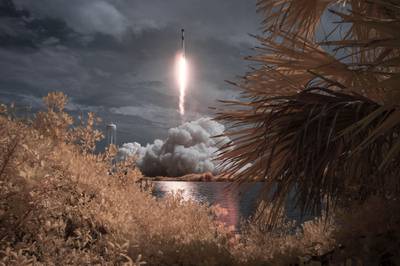 A SpaceX Falcon 9 rocket carrying the company's Crew Dragon spacecraft is seen in this false color infrared exposure as it is launched on NASA’s SpaceX Demo-2 mission to the International Space Station with NASA astronauts Robert Behnken and Douglas Hurley onboard, Saturday, May 30, 2020, at NASA’s Kennedy Space Center in Florida.