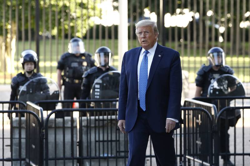 President Donald Trump walks in Lafayette Park to visit outside St. John's Church across from the White House Monday, June 1, 2020, in Washington.