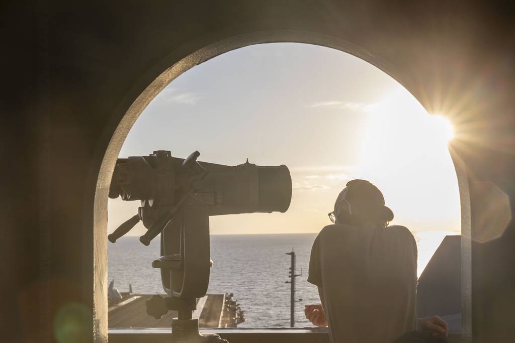 A sailor stands forward lookout watch aboard the aircraft carrier Dwight D. Eisenhower in the Gulf of Oman, Nov. 15, 2023.