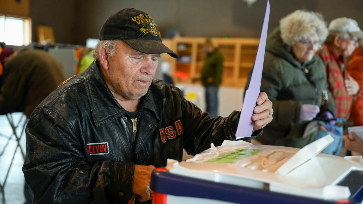 Melvin L. Quakenbush drops his ballot in the box after voting at the Pablo Christian Church on the Flathead Indian Reservation in Pablo, Mont., Tuesday, Nov. 8, 2022. (Tomy Martino/AP)