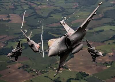 Two U.S. Air Force F-35A Lightning IIs assigned to Hill Air Force Base, Utah, and two Dassault Rafales assigned to Saint-Dizier-Robinson Air Base, France, break formation during flight May 18, 2021, over France. The flight was a part of exercise Atlantic Trident 21, a joint, multinational exercise involving service members from the U.S., France and the United Kingdom. (Staff Sgt. Alexander Cook/Air Force)