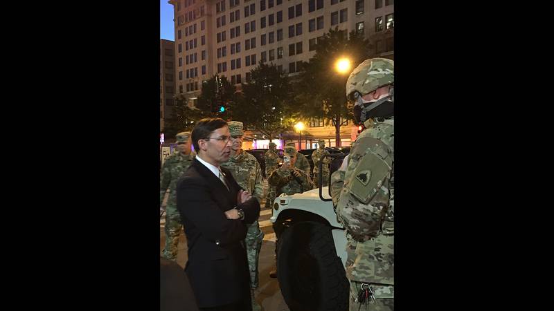 Defense Secretary Mark Esper greets D.C. National Guard troops hours after visiting St. John’s Episcopal Church with President Donald Trump, Chairman of the Joint Chiefs of Staff Army Gen. Mark Milley and other leaders.