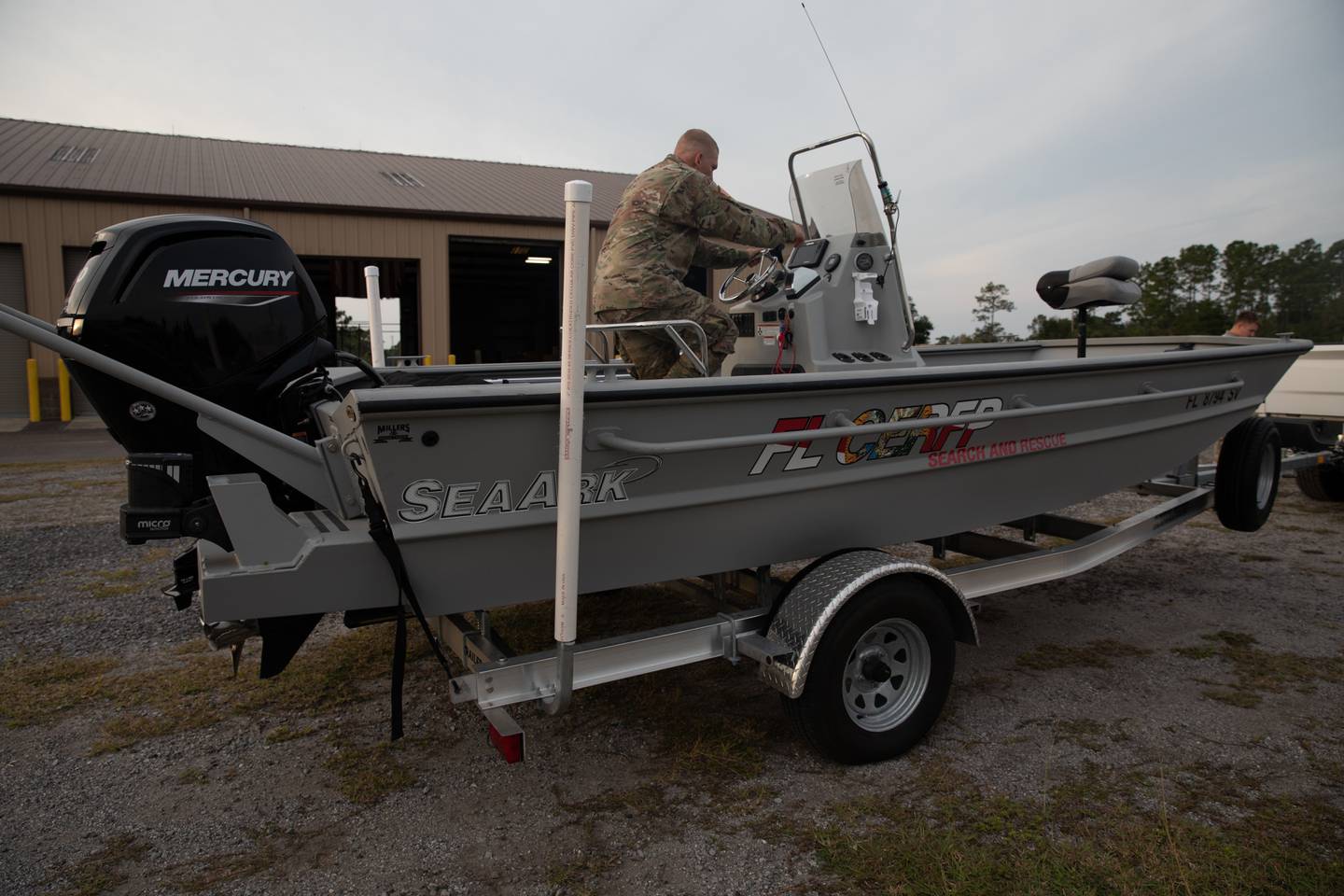 Florida National Guard Army Pfc. Kenneth Bonn inspects a search and rescue vessel during Hurricane Ian state activation, Camp Blanding Joint Training Center, Fla., Sept. 27, 2022.