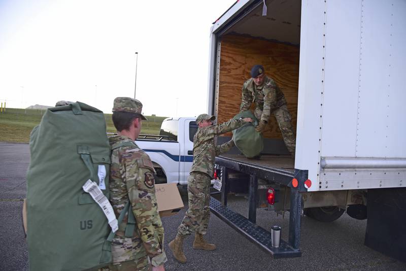 Airmen from the 134th Air Refueling Wing prepare to depart to assist with natural disaster relief operations in the aftermath of Hurricane Ian.