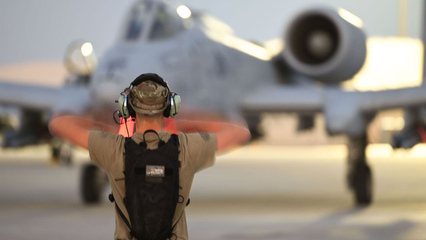 An airman directs an A-10 Thunderbolt II pilot to a parking location on Oct. 27, 2023, within U.S. Central Command's area of responsibility, which spans northeast Africa and across the Middle East to Central and South Asia. (Courtesy of the U.S. Air Force)