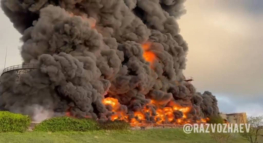 In this handout photo taken from video released by the Governor of Sevastopol Mikhail Razvozhaev telegram channel on Saturday, April 29, 2023, smoke and flame rise from a burning fuel tank in Sevastopol, Crimea.