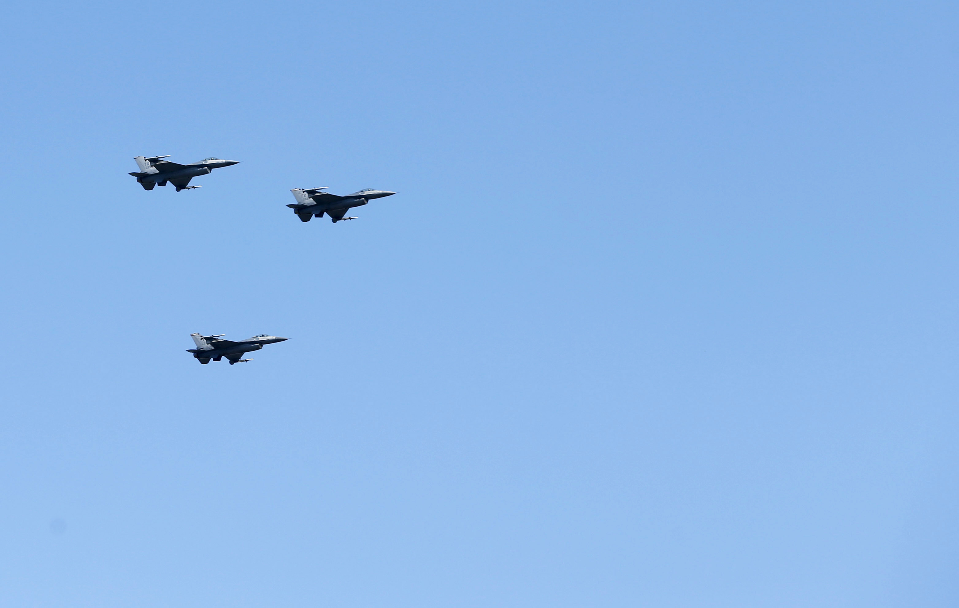 In honor of Ross Perot's commitment to the military and veterans, F-16 fighter jets fly during his gravesite service in a missing man formation over Sparkman-Hillcrest Memorial Park Cemetery in Dallas on Tuesday, July 16, 2019.